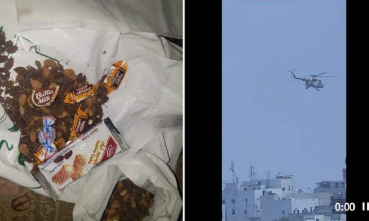 شاهد الطيران المروحي يلقى حلويات على المنازل في صنعاء